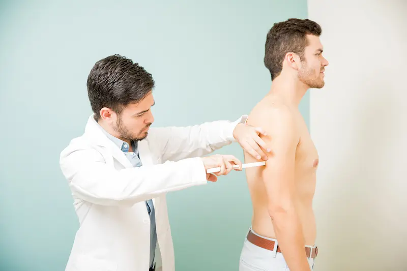 profile-view-shirtless-young-man-getting-evaluation-nutritionist-s-office