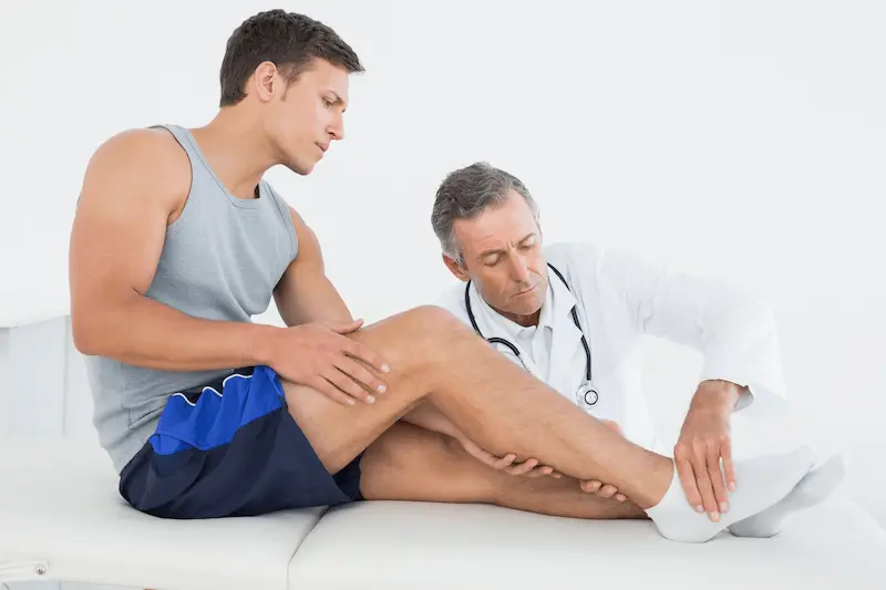 side-view-young-man-getting-his-leg-examined